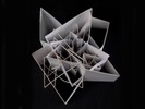 Photograph of white model with extruded and intersecting planes.
