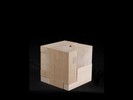 Photograph of bass woodcube model with shifted portions of the cube.