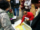 An instructor points to a section of a geologic map.