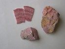 Botryoidal, crystalline, and fine grained massive rhodonite. 