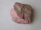 Rhodonite showing cleavage surface. 