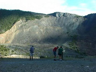 Students examining the aftermath of a landslide