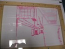 Photo of a student sketch on plexiglass showing the view through a frame.
