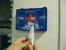 Photo of the lettering on the first aid sign as seen through a lens, appearing upside-down.