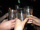 Photo of students raising their glasses in a toast to Galileo.