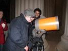 Photo of a student looking through the telescope at Jupiter.