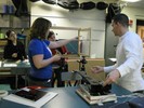 Photo of students setting up a line-of-sight string toward a lute.