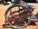 Side view photo of trike's rear wheels and supporting structure.