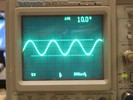Oscilloscope displays a 10 volts peak-to-peak sine wave.