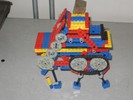 A Lego robot with three pairs of legs.