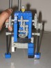 Another humanoid robot, with an actual Lego head on top, and arms extending down to the ground.