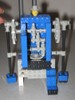 Another humanoid robot, with an actual Lego head on top, and arms extending down to the ground.