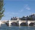 The Pont Neuf bridge in Paris on a sunny day.