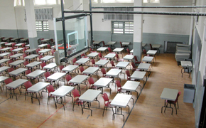 A large room with separate tables and chairs for every student.