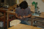 A student adjusts a spokeshave.