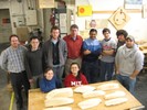 The instructors and class with all of their completed half-hull models.
