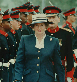 A woman walks past a row of officers.