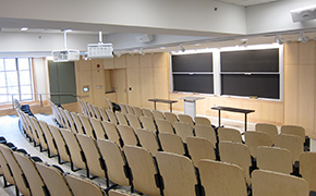 View of front of the classroom from the right side of the sixth row.