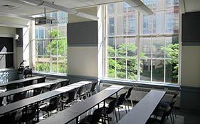 View of the classroom seating from the back left side of the room.