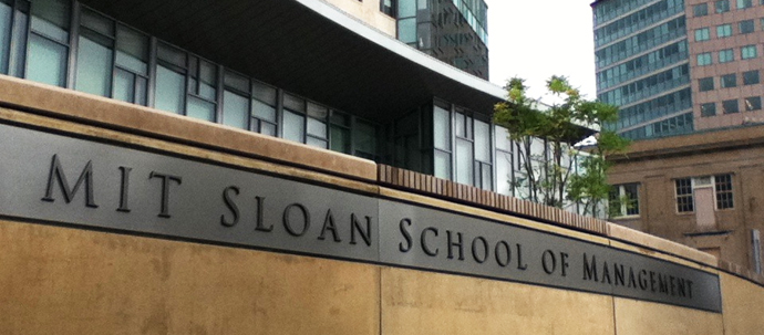 A photo of a sign reading "MIT Sloan School of Management".