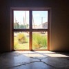 A photo of a window located in an old wool factory inside of the Chinati complex.