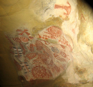 Cave painting with intricate geometric patterns.