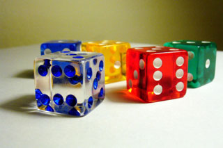 Five multicolored dice on a white background.