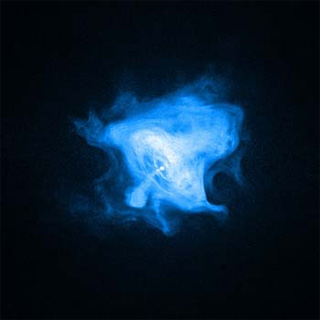 This is an image of the Crab Nebula. It is bright blue and shaped like a bell against a black background.