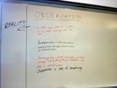 Notes on a whiteboard explain observations.