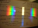 Notes on a whilteboard explain spectrum of light.