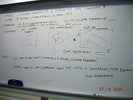 Whiteboard notes about poster with instructor's example.