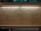 Handwritten notes on a whiteboard about x-ray binary systems.