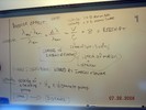 Notes on a whilteboard explain Hubble's Law.