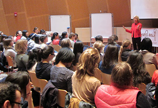 Photo of Dr. Barbara Tannenbaum speaking at the front of an auditorium.